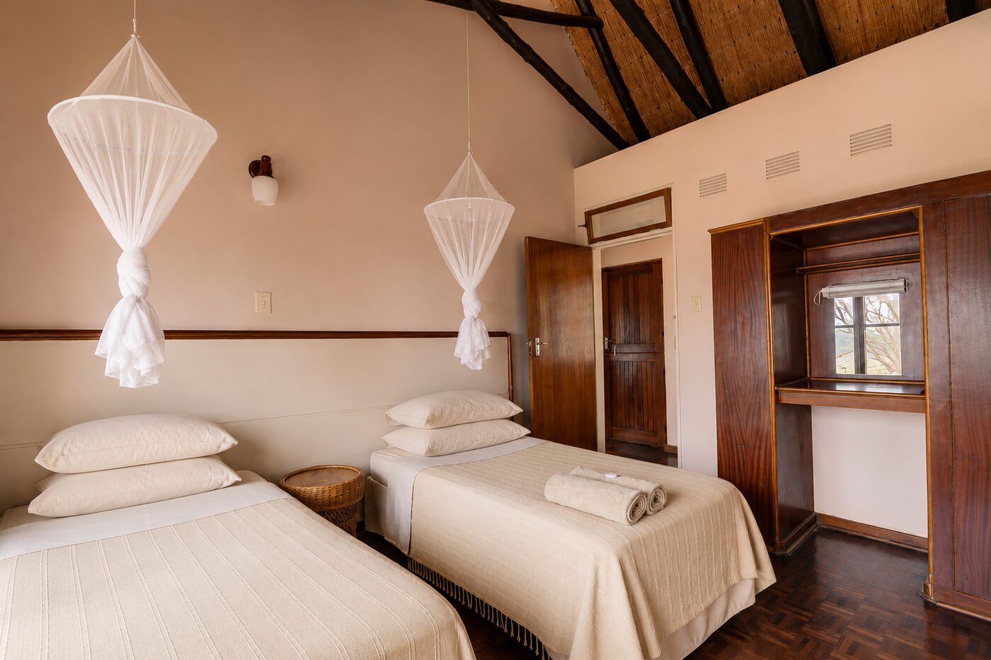 Twin-bed bedroom with mosquito net