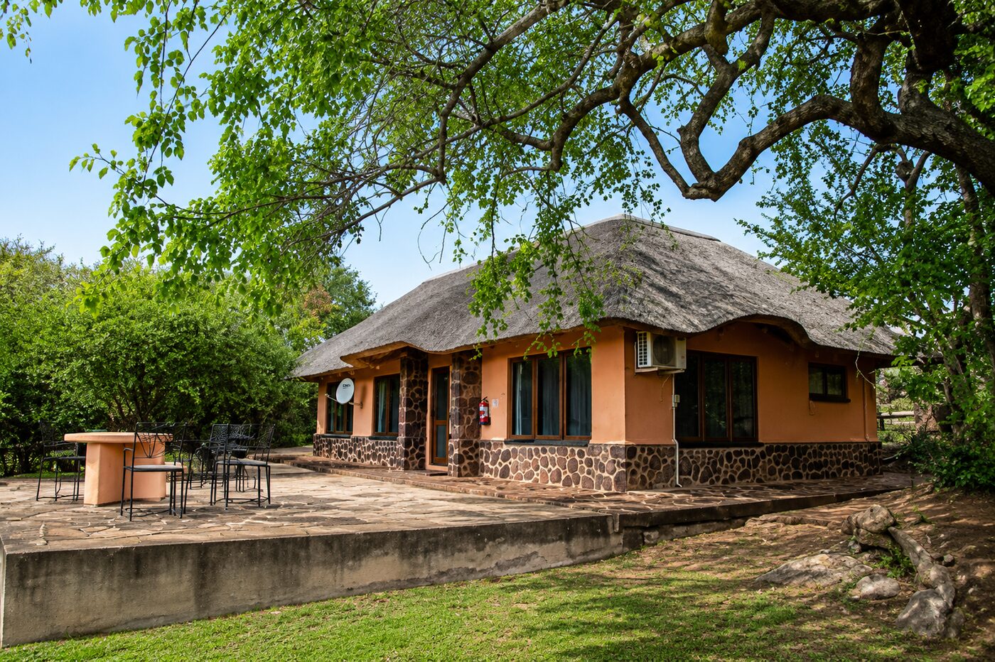 Stone patio with braai and seating
