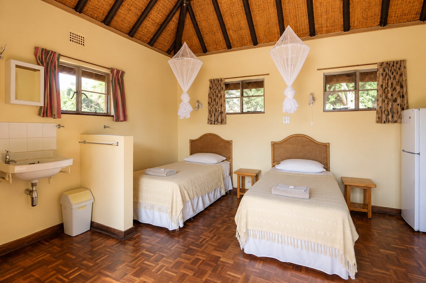 Twin-bed rest hut interior with mosquito net