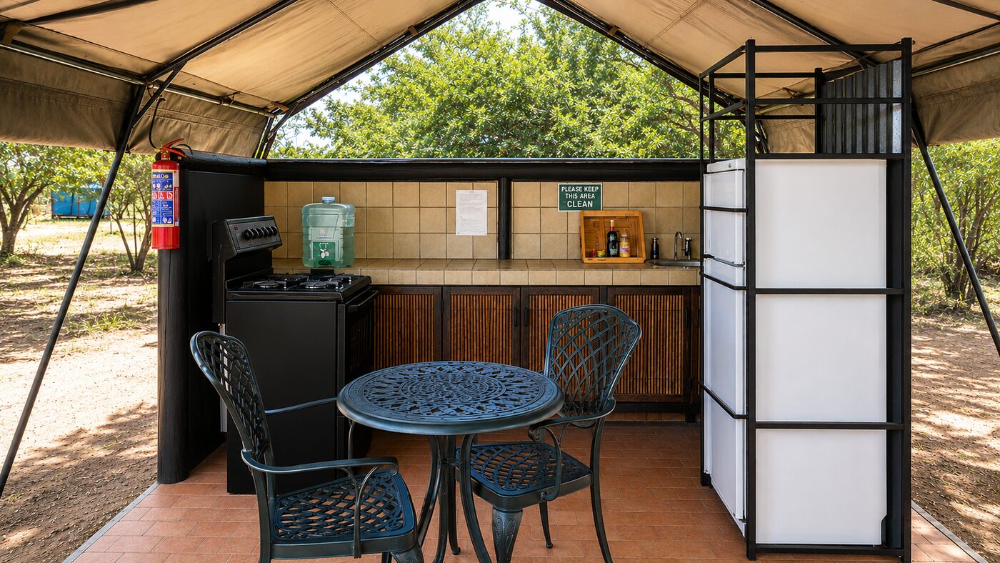 Open-air kitchen and dining area for 4-sleeper safari tents